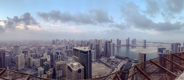 High angle view of buildings in city against sky