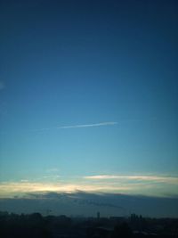 Scenic view of landscape against blue sky