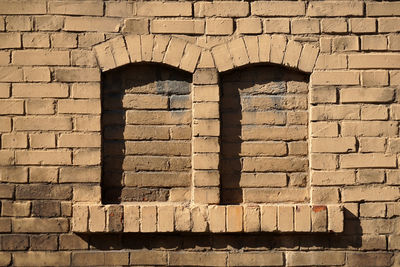 Low angle view of brick wall