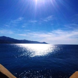 Scenic view of sea against blue sky