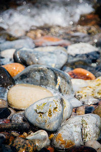 Close-up of stones in lake