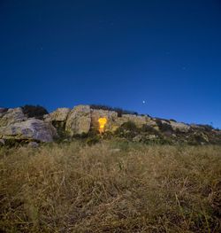 Scenic view of field against sky at night