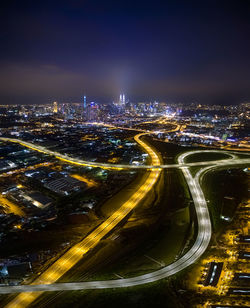 High angle view of illuminated cityscape at night
