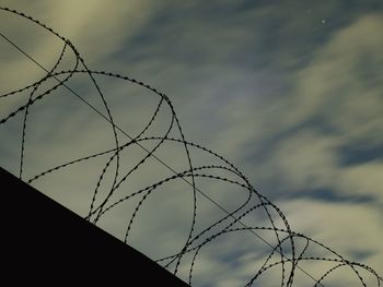 Low angle view of lamp post against the sky