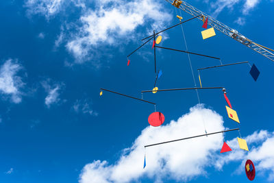 Low angle view of vapor trail against blue sky