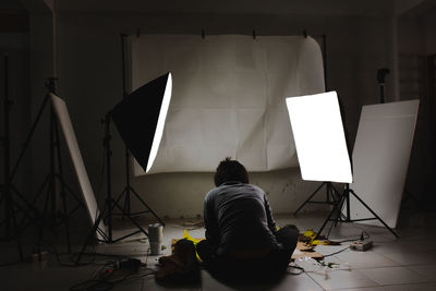 Rear view of woman photographing