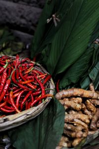 Red chili peppers and gingers for sale at market