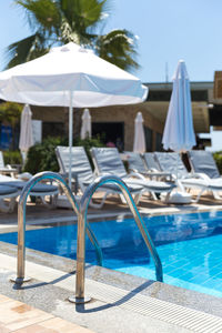 Chairs and tables in swimming pool