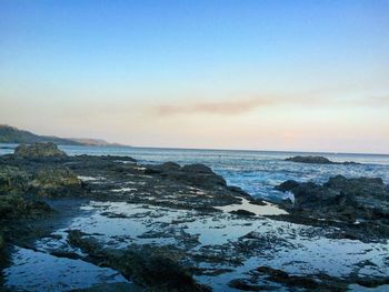 Scenic view of sea at sunset