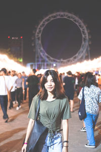 Portrait of woman standing at traveling carnival