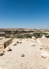 Panoramic shot of buildings against clear blue sky