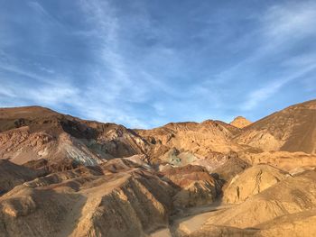 View of desert against cloudy sky