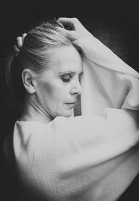 Portrait of blonde woman in white blouse iv