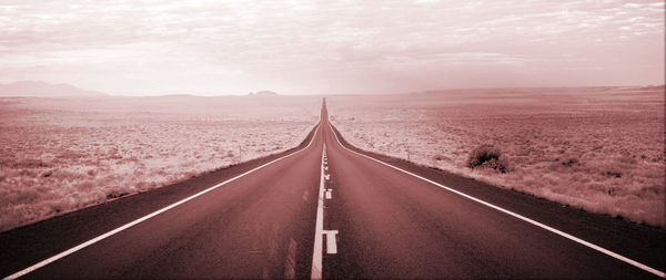 Empty road along landscape