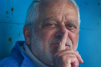 Close-up portrait of man wearing mask