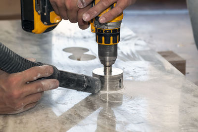 Midsection of man working on floor