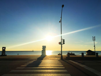 Scenic view of beach against sky during sunset