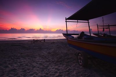 Scenic view of beach against sky during sunset