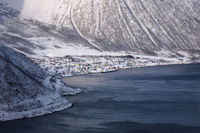 High angle view of townscape by sea