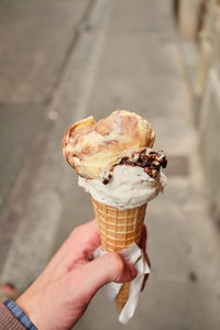 Cropped image of hand holding ice cream