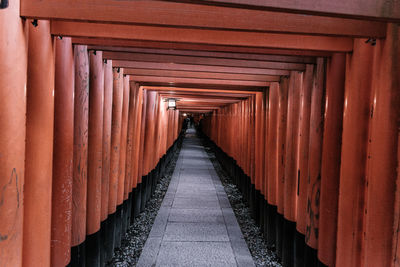 Empty footpath leading towards temple in building