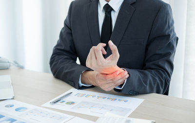 Midsection of a person on table