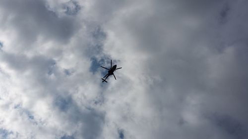 Low angle view of airplane flying in sky