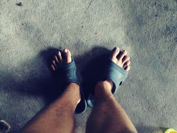 Low section of woman standing on floor