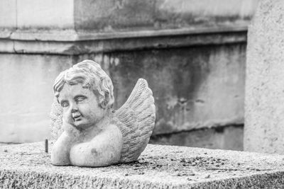 Close-up of statue against wall