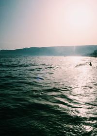 Scenic view of sea against clear sky during sunset