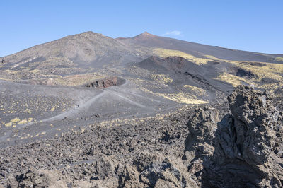 The etna volcano with its craters, lava and lunar landscape