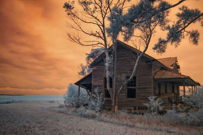 Built structure against sky at sunset