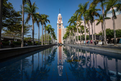 Reflection of trees and building in water