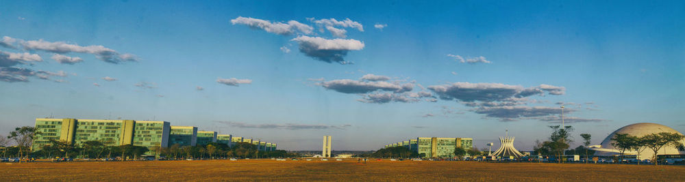 Panoramic view of city against blue sky
