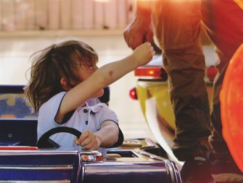 Boy driving toy car