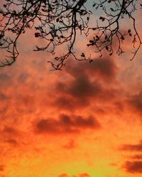 Low angle view of cloudy sky at sunset