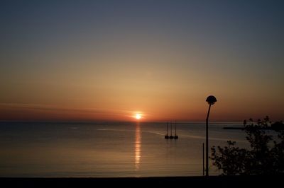 Scenic view of sea against sky at sunset