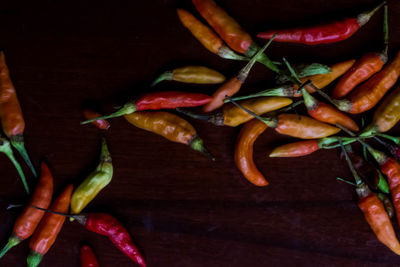 High angle view of chili peppers on table