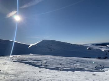 Scenic view of snowcapped mountains against sky