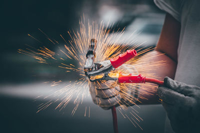 Close-up of hand holding fireworks