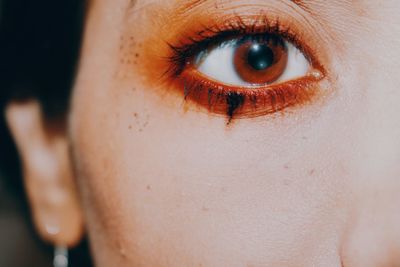 Close-up of woman with eye make-up