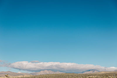 Scenic view of landscape against clear blue sky