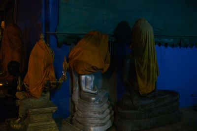 Rear view of statue against temple building