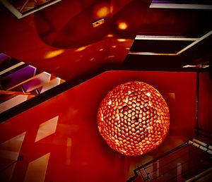 Low angle view of illuminated lanterns hanging on ceiling