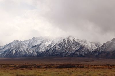 Scenic view of snowcapped mountains against sky