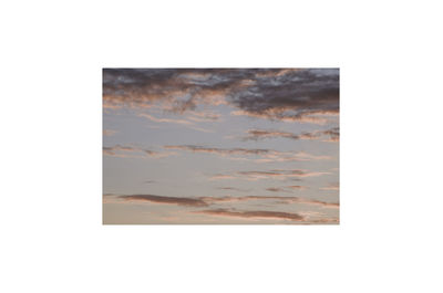 Digital composite image of wall against sky