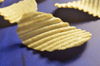 Close-up of potato chips on table