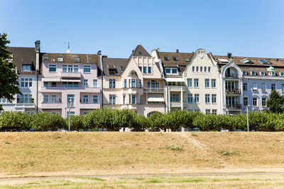 Residential buildings against blue sky