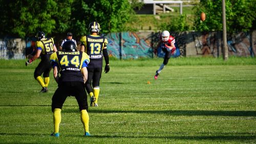 Group of people playing on grassland