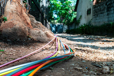 Close-up of multi colored umbrella on street